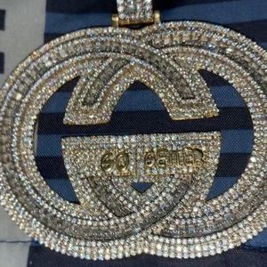 This is a Gucci go geter pendant good to ware with white and yellow gold